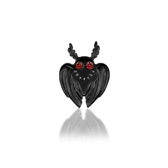 Rhodium Black Gold: Junipurr Jewelry’s Moth Man threadless stud in Rhodium Black Gold, featuring Dark Garnet eyes in a legend