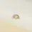Thumbnail: Side view of Fanfare in yellow gold, highlighting its elegant fan shape and prong-set gemstone arrangement.