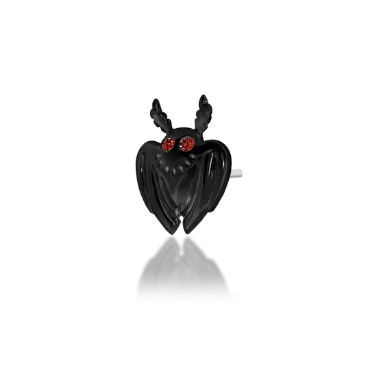 Rhodium Black Gold: Junipurr Jewelry’s Moth Man threadless stud in Rhodium Black Gold, featuring Dark Garnet eyes in a legend