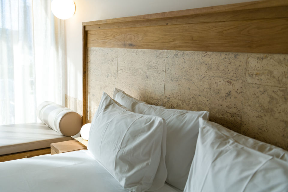 The Calile Hotel, New Generation Cork Calais Cream cork tiles, guest room, bed with pillows and cork bedhead