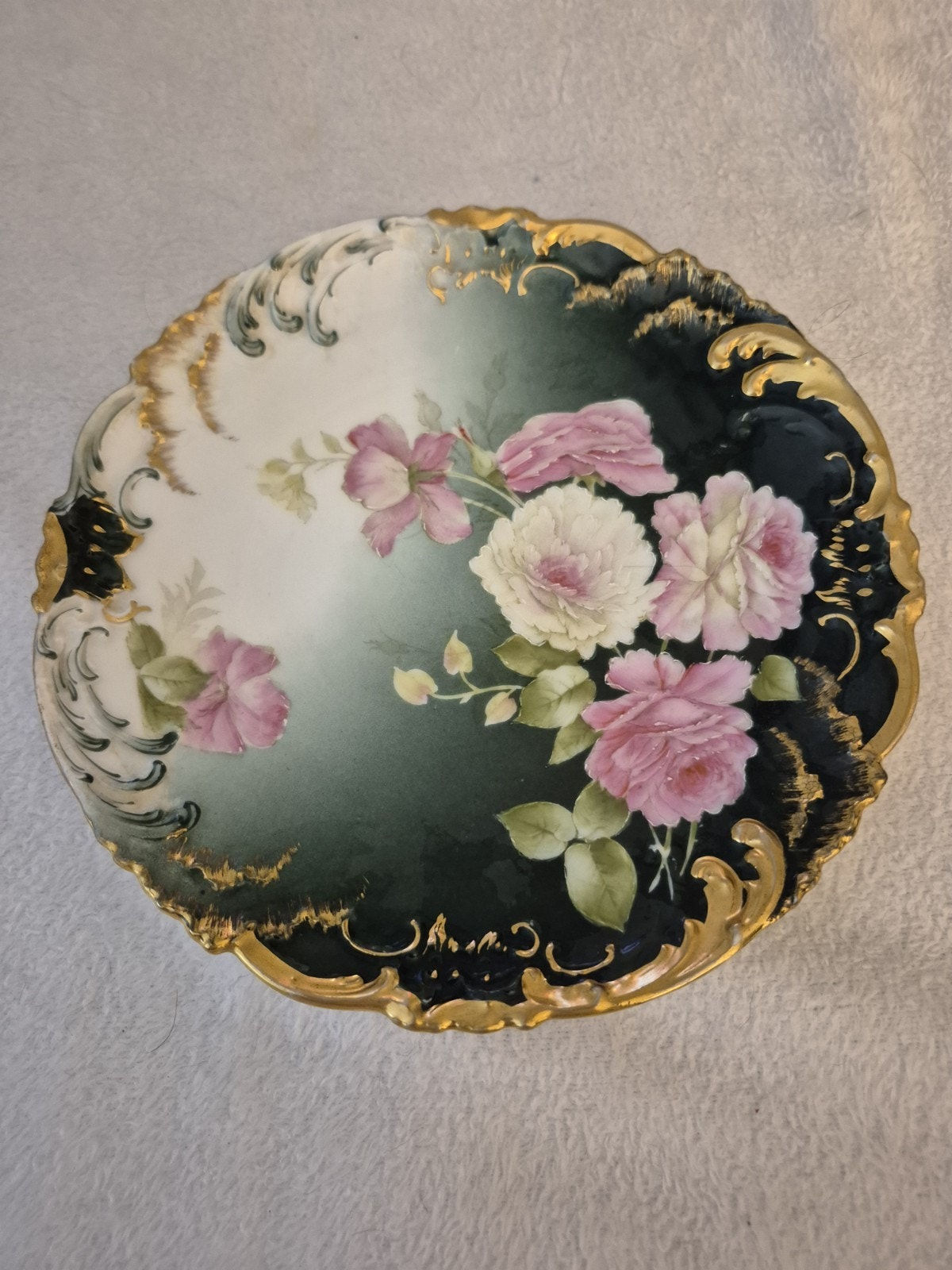 Ornate plate with pink and white roses and gold details