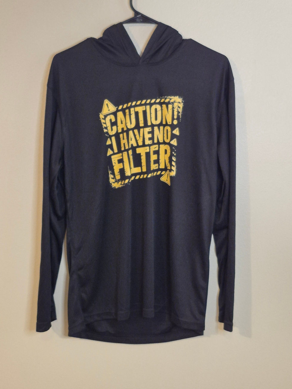 Black hoodie with text 'CAUTION! I HAVE NO FILTER'
