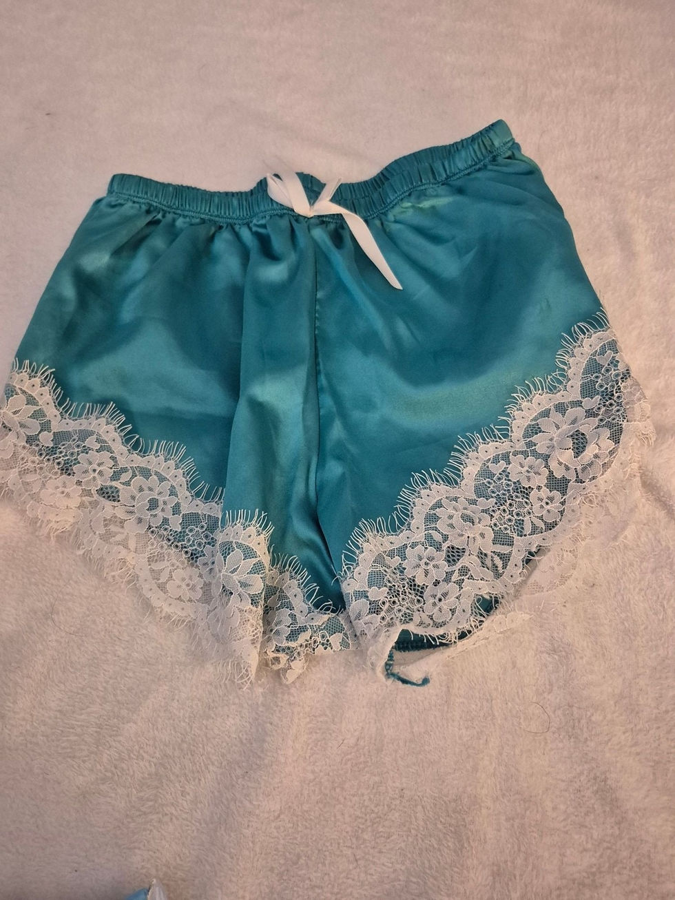 Teal satin shorts with white lace and drawstring waist