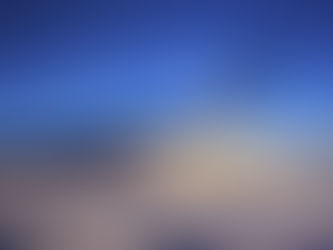 Airplane wing in sunset over sea of fog
