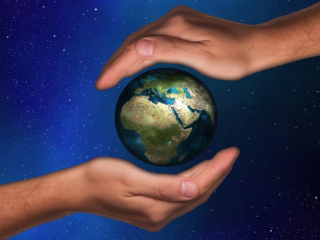A planet held in two hands in space