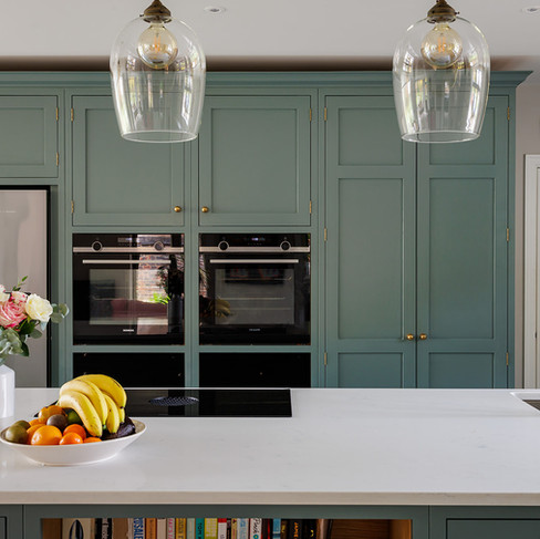 Luxury family kitchen painted in Little Greens Livid. In Cranleigh, Surrey.