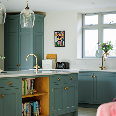 Luxury family kitchen painted in Little Greens Livid. In Cranleigh, Surrey.