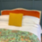 Antique French Upholstered Bed with carved flower detail