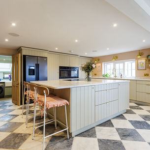 A Contemporary Country Kitchen in Petworth with Checkerboard Marble Floors and Dropcloth Cabinetry
