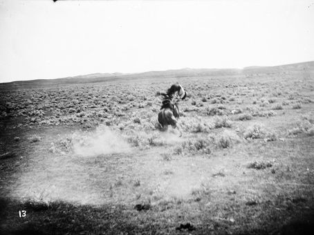 Historic L.A. Huffman photograph of a cowboy being thrown from a bucking horse on the open range near Miles City, Montana, circa 1898.