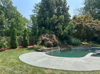 Pool deck resurfaced in Granite Boulder finish with bold granite-style aesthetic