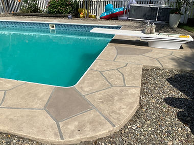 RenuKrete resurfaced pool deck in Sandstone showing subtle textured pattern in Rockville, MD