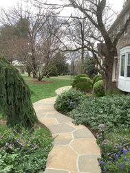 RenuKrete resurfaced pool deck in Hurricane Slate showing deep gray stone tones