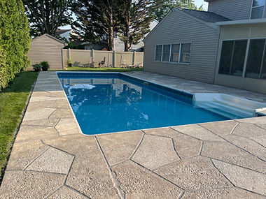 RenuKrete resurfaced pool deck in Sandstone showing subtle textured pattern in Hartford, CT