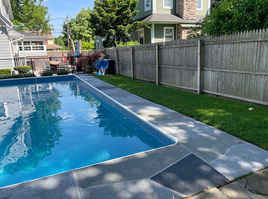 Upgraded concrete pool deck in Granite Slate finish with clean gray slate look.