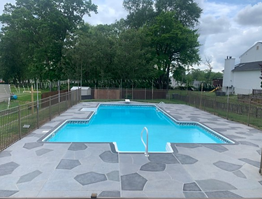 Granite Slate decorative concrete pool deck surface in Summit, NJ with stone inspired pattern.