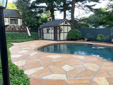 Warm-toned Tuscany pool deck renovation with subtle textured surface