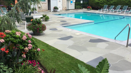 Granite Slate pool deck concrete repair and resurfacing project in Suffolk County NY.