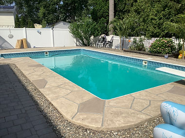 RenuKrete resurfaced pool deck in Sandstone showing warm earth-tone surface