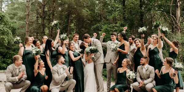 Wedding party celebrating outside
