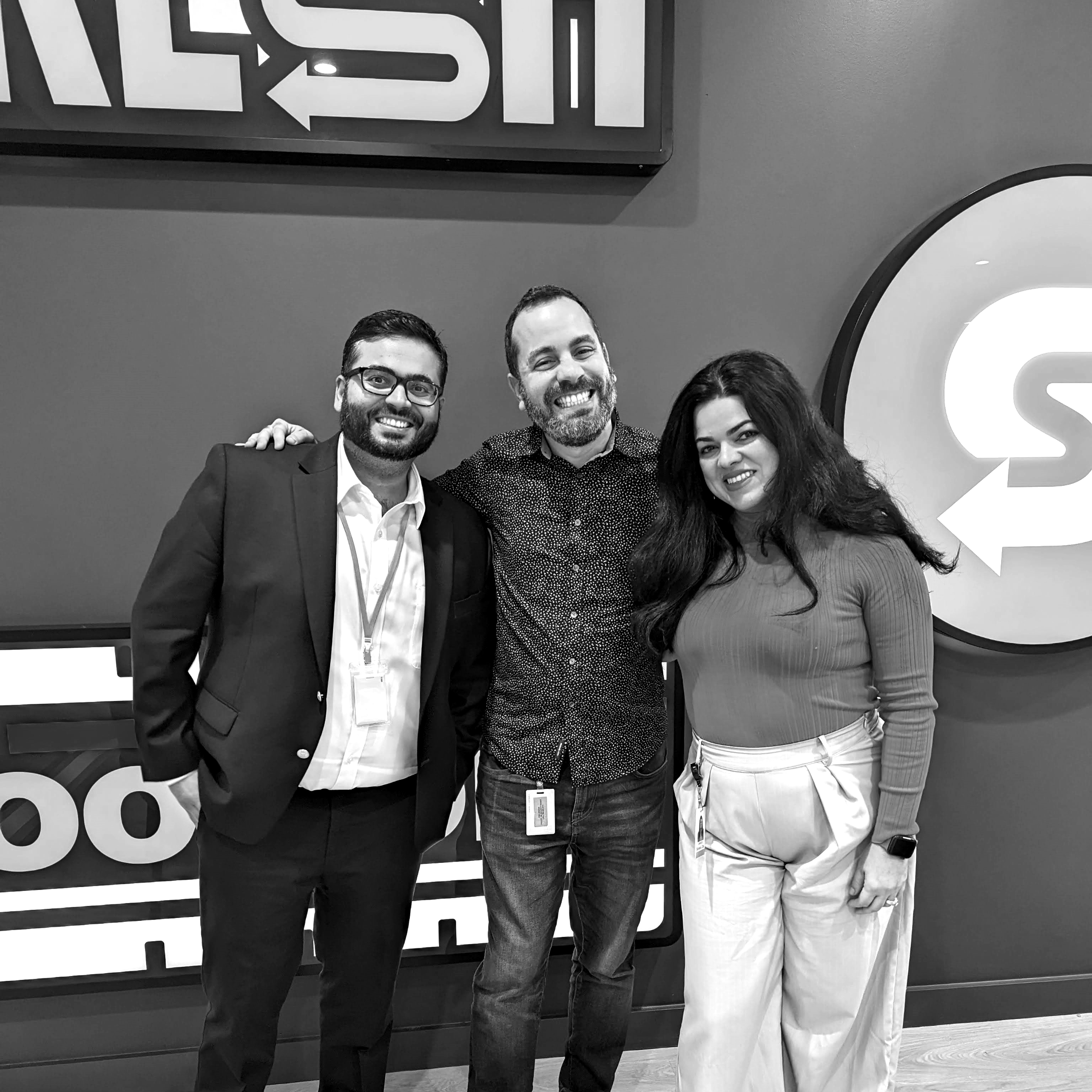 Three smiling people