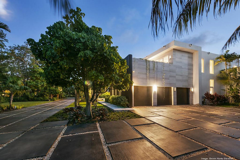 3 car garage with tiled hardscaping at Tyler Herro's home designed by HS2G, Peter Strelkow
