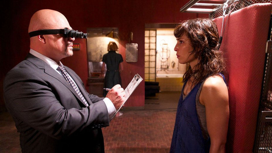 Michael Chiklis and Noomi Rapace in Rupture