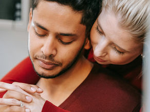 Multicultural couple hugging