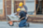 Worker experiencing lower back pain from improper manual handling