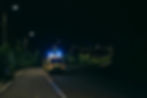 Ambulance with its emergency lights on in an isolated area representing isolated first aid requirements