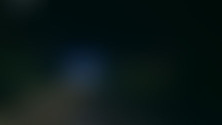 Ambulance with its emergency lights on in an isolated area representing isolated first aid requirements