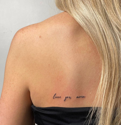 calligraphy tattoo on back