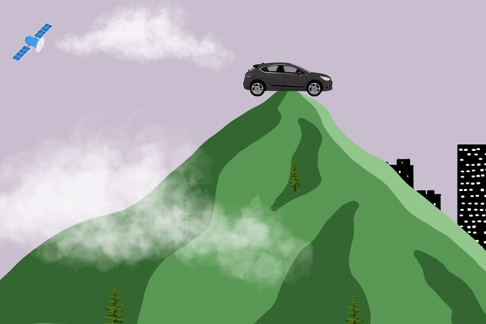 A SUV on top of a mountain with a satellite following it