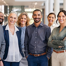 Portrait of successful group of business people at modern office looking at camera. Portra