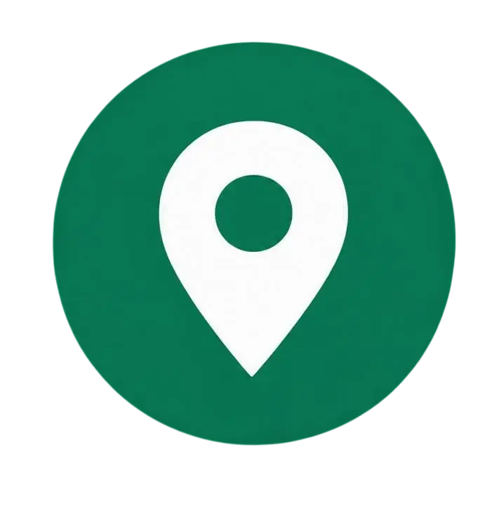 Digital icon of a white location pin marker on a green circular background. This graphic element is commonly used to represent a geographical location, address, or point of interest.