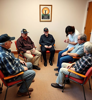 Group of 5 veterans both men and woman sitting in chairs in a semi circle experiencing com