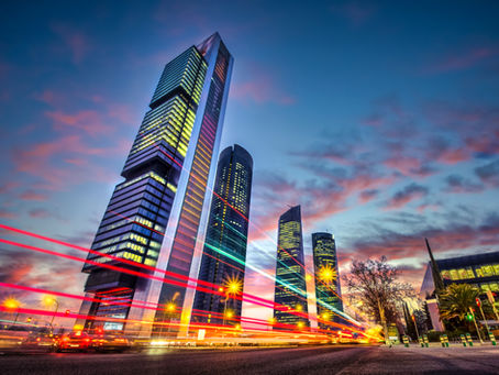 Modern business district in Spain representing international commercial activity and institutional pace
