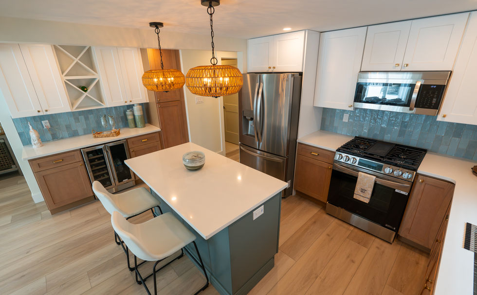 Modern white and green kitchen with lots of storage space