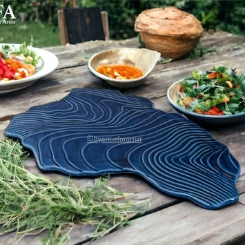 Elevate your hotel's dining experience with BAFA's Island Platter. Crafted from high-quality ceramic stoneware, these platters feature a distinctive island-inspired design, perfect for showcasing your culinary creations. They are dishwasher and microwave safe, ensuring convenience and versatility in any kitchen setting. Lead-free and engineered for double durability, these platters offer long-lasting performance. Customize them with your preferred finish to seamlessly blend with your hotel's ambiance. Ideal for serving a variety of dishes, these platters are a stylish and practical addition to your tableware collection