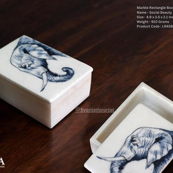 Elegant rectangular box featuring a hand-painted elephant face design, ideal for gifting in hotels. This stylish box combines traditional craftsmanship with intricate, hand-painted artwork of an elephant face, adding a touch of cultural charm and sophistication. Perfect for hotel gifting programs or upscale welcome packages, it offers a unique and refined keepsake. The rectangular box blends practicality with artistic elegance, making it a sustainable and thoughtful gift option that enhances the guest experience with its blend of intricate design and cultural significance