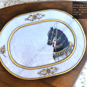 Exquisite Marble Meenakari Oval Tray featuring a vibrant hand-painted horse design with intricate detailing. Adorned with a luxurious golden border and traditional Meenakari artwork, this decorative tray is perfect for serving, gifting, or enhancing home décor. A unique blend of elegance and craftsmanship, ideal for festivals, weddings, and royal-themed interiors