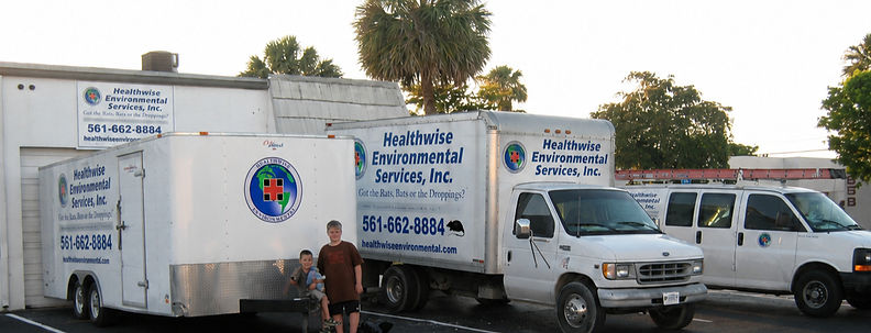 Health-Wise Environmental service vehicles providing rodent removal, wildlife removal, attic cleaning, and bat removal services in Palm Beach County, Florida.
