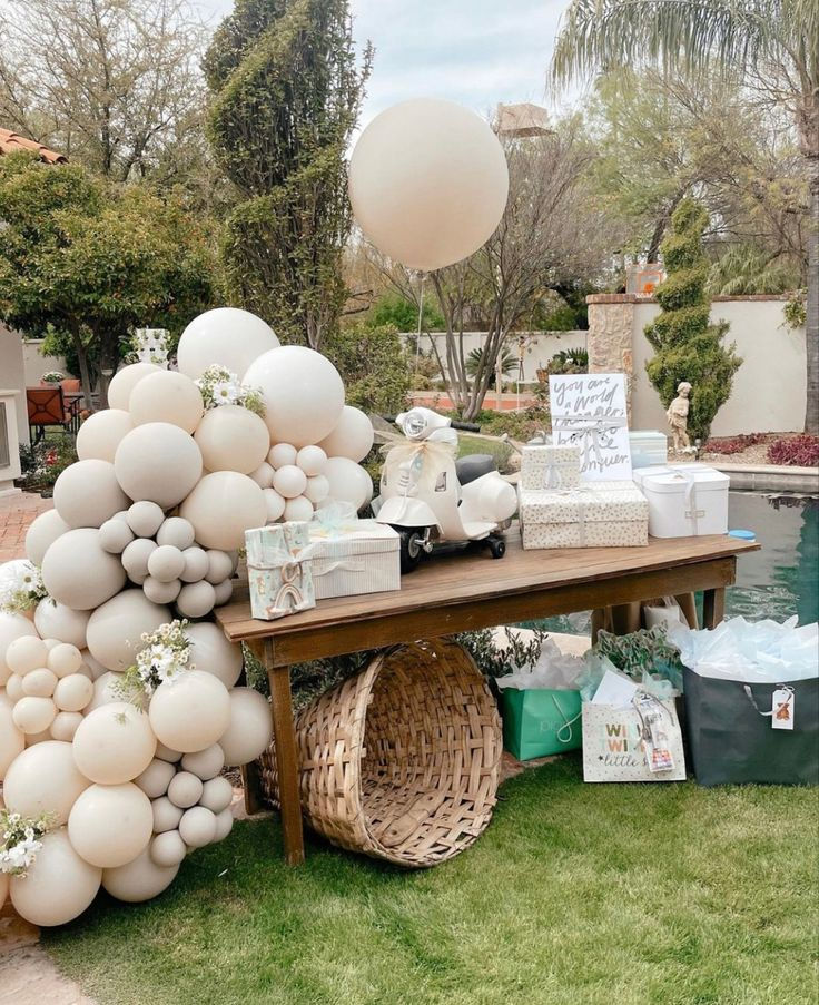 Baby shower garden table setup in Vaucresson with elegant floral decor and soft colors