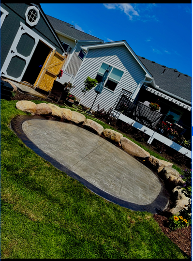 Paver Stamped Concrete + Boulder Wall Designed Space
