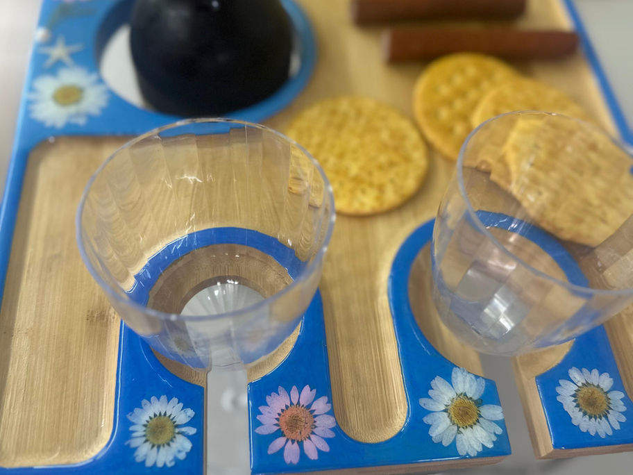 Wine board showcasing built-in bottle holder and four glass compartments