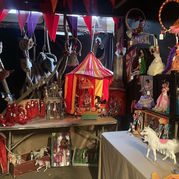 Somerset Arts Weeks colour photograph of an artist's stall featuring miniature carousels.