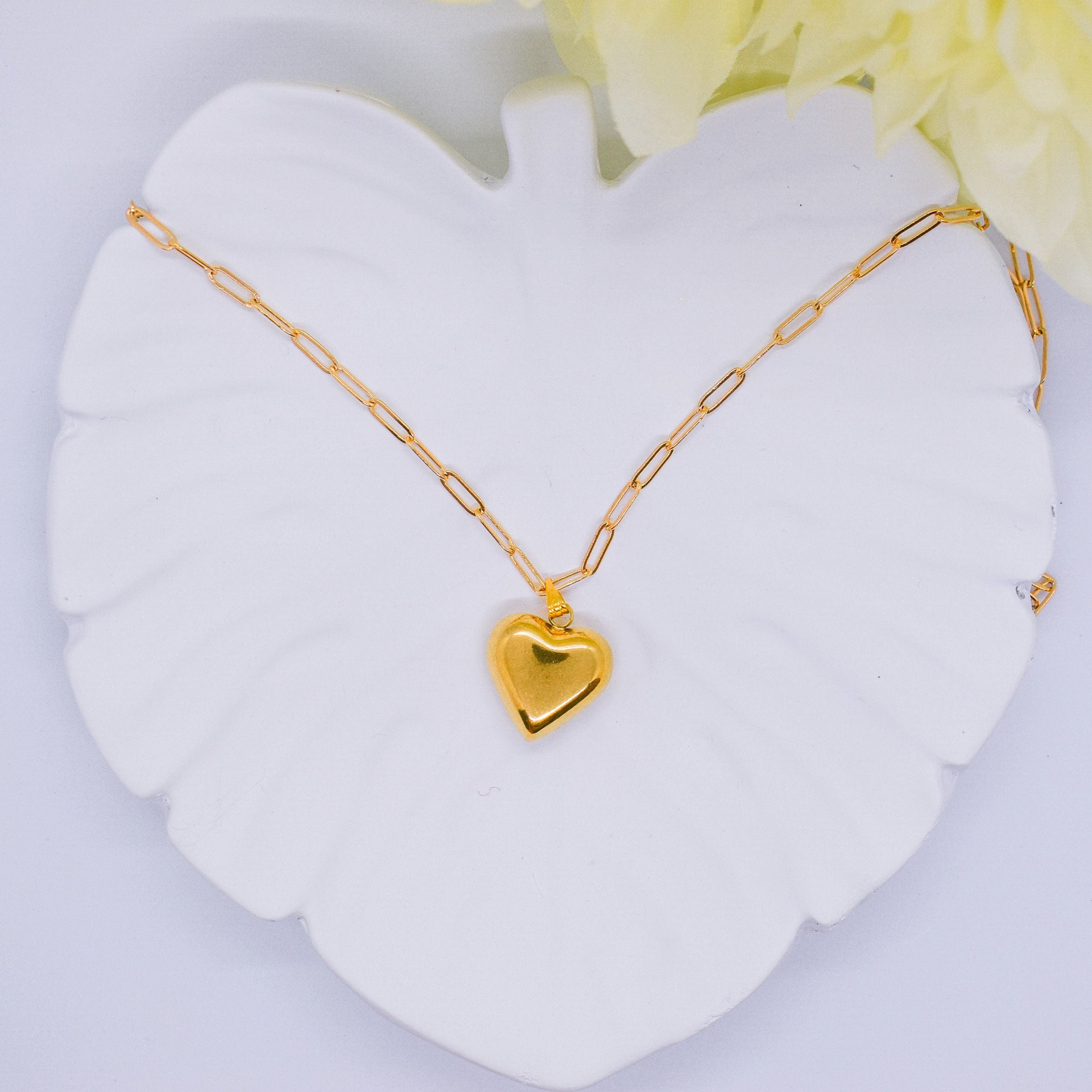 chunky heart necklace on a tray