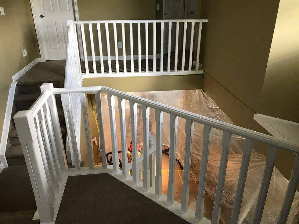 Interior stairwell painting in Calgary with freshly painted white railings and trim — Calgary Painter 4U