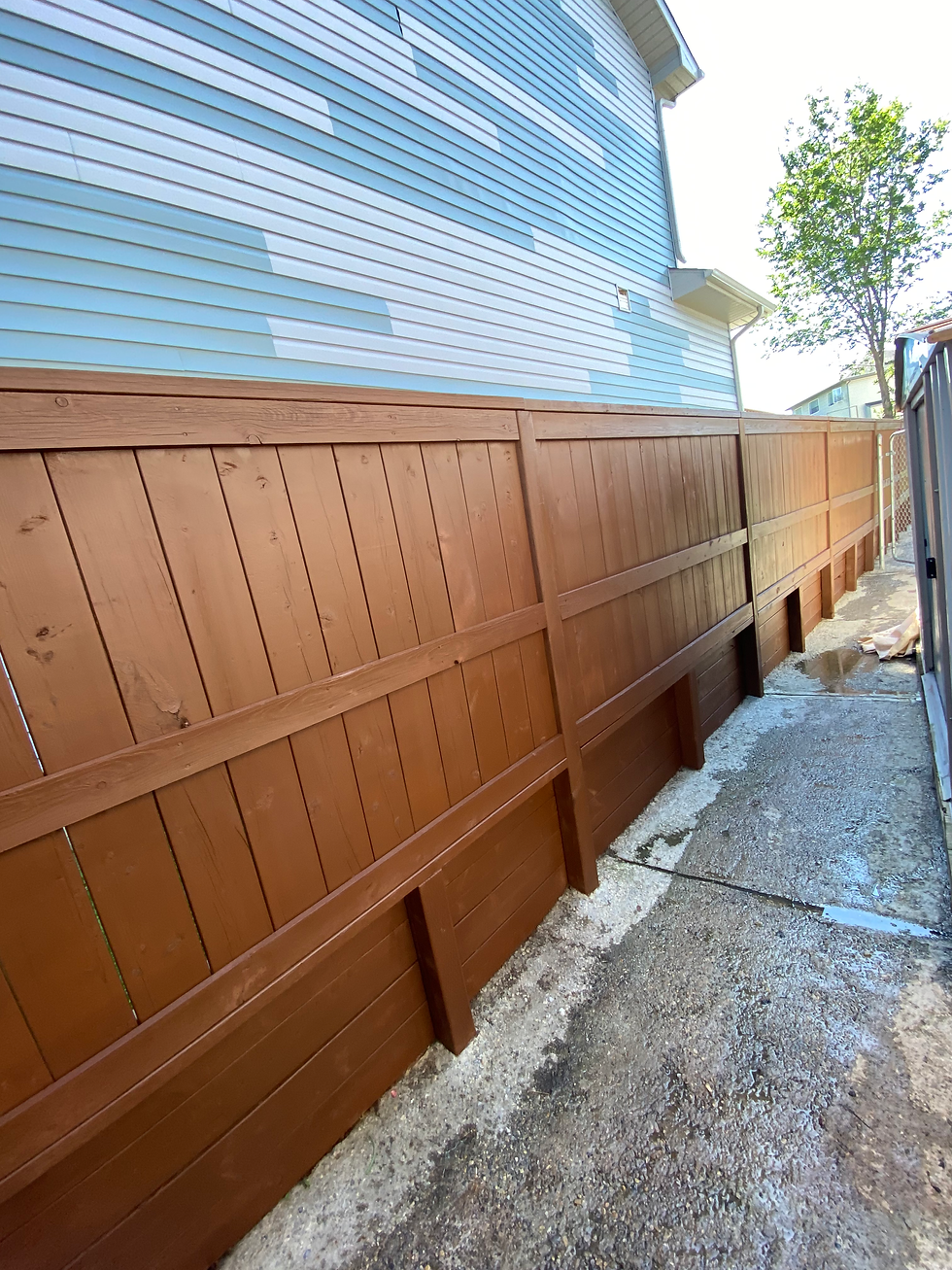 Fence staining prep and oil stain finish on a Calgary residential fence