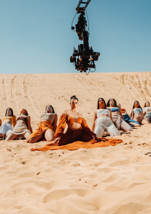 Bruce Melan directing Angel Baranes behind the scenes of a music video shoot.